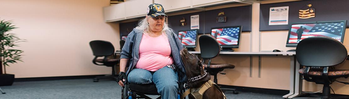 Veteran sits in a PCC Veterans Center with their service animal